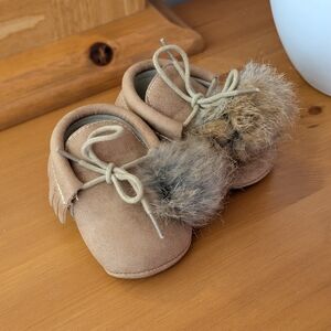 Cozy Tan Baby Moccasins with Fur Pom Poms
